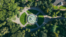 Aerial Top View Of A Stone Fountain On The Square In The Park In Summer
