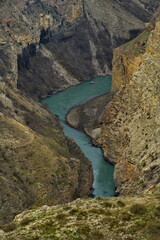 Wall Mural - Russia. North-eastern Caucasus. The Republic of Dagestan. A fragment of the Sulak River in the famous Sulak Canyon. View from the rocks near the Miatlin reservoir dam.