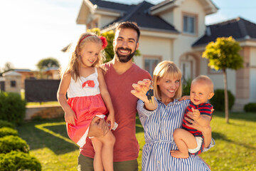 Canvas Print - Family holding keys after buying house