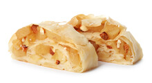 Pieces of delicious apple strudel with almonds on white background