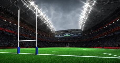 Wall Mural - Rugby stadium with goal posts from view behind. Grassy playground and fan crowd on background. Digital 4k video loop for sport advertisement.