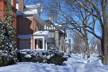 Sticker - Snow covered sidewalk of residential street on a sunny morning