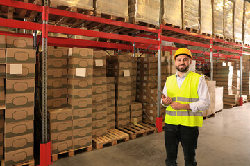 Wall Mural - Man with tablet working at warehouse. Logistics center