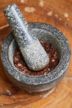 Mortar And Pestle With Crushed Cacao