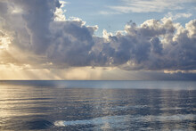 Clouds And Sunbeams Over Ocean At Sunrise