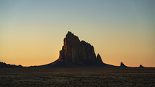 USA, New Mexico, Desert Landscape With Ship Rock At Sunset