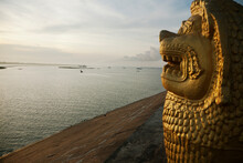 Cambodia, Phnom Penh, Lion Statue And Tonle Sap River
