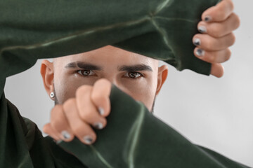 Wall Mural - Brown eyed man with stylish manicure, closeup