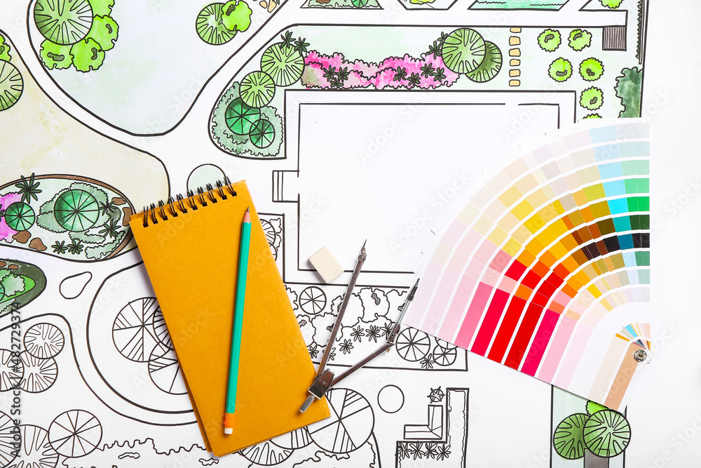 Stationery with paint palettes on plan of landscape designer