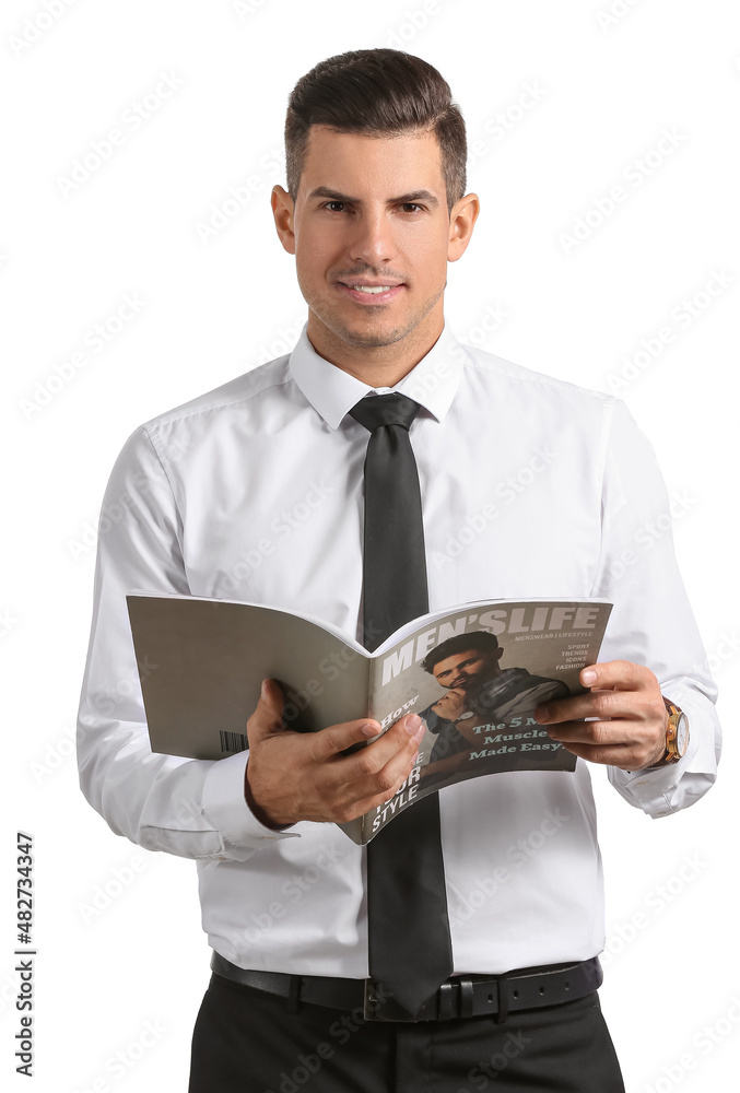 Handsome man in formal clothes holding magazine on white background
