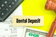 calculators, banknotes, receipts with the word deposit rental