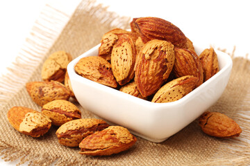 Wall Mural -  almonds nuts on white background.