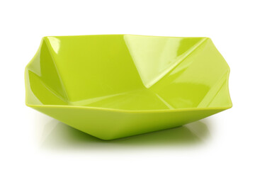 Wall Mural - Bright green plastic empty bowl on a white background