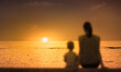 © kieferpix - mother and child watching sunset, focus on sunset