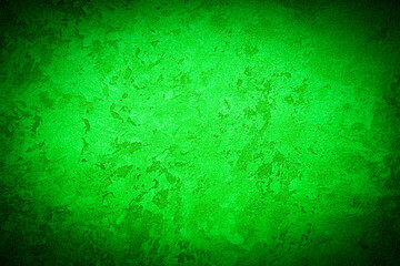 Texture of green decorative plaster or concrete with vignette.