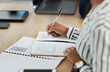 © Katleho S/peopleimages.com - Leave no info behind. Cropped shot of a businesswoman writing notes during a meeting in a modern office.