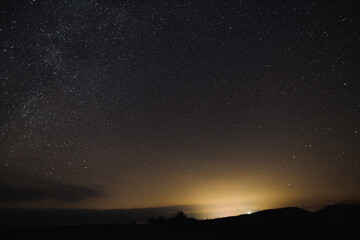 Wall Mural - A beatiful starry sky over the nature in winter near Banska Bystrica