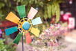 © boommaval - colorful windmill toy on nature blur background