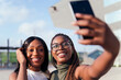 © Raul Mellado - young black friends smiling happy to take a selfie