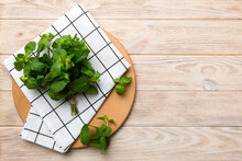 Fresh Mint On Cutting Board Table, Top View. Flat Lay Space For Text