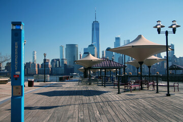 The blue emergency column on a wooden walkway overlooking downtown Manhattan