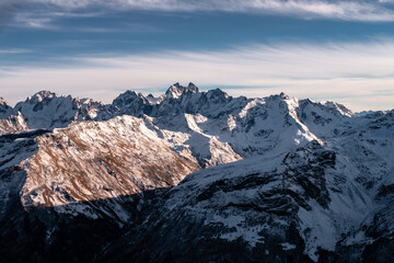 Wall Mural - Snowy mount Ushba. Greater Caucasus ridge. Sunny day. Before suset. View from russian side