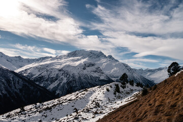 Wall Mural - Snowy Greater Caucasus ridge. Sunny day. Before suset. View from 3500m
