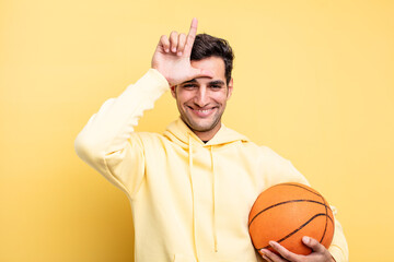 young handsome hispanic man. basketball concept