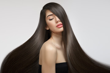 Fashion woman with straight long shiny hair. Beauty and hair care