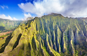 Wall Mural - Deeply etched cliffs along Kauai's Na Pali Coast on a sunny Spring afternoon