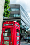 Fototapeta Londyn - Red Telephone booth in London with reflection of St Paul's Cathedral in the backround