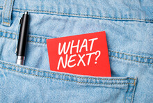 The Back Pocket Of Blue Jeans Contains A White Pen And A White Red Card With The Text WHAT NEXT