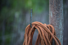 Close-up Of Rope Tied On Wooden Post