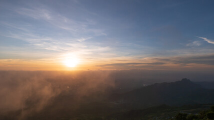 Wall Mural - Bright orange sky and light of the sunrise at morning.