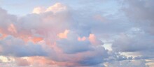 Clear Sky, Glowing Cirrus And Cumulus Clouds After The Storm, Soft Sunlight. Dramatic Sunset Cloudscape. Meteorology, Weather, Climate, Heaven, Peace. Graphic Resources. Picturesque Panoramic Scenery