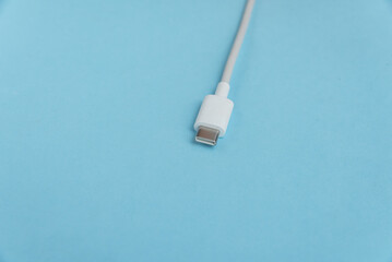 USB cable type C over blue background