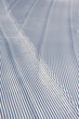 © knelson20 - Fresh snowfall after the groomers have finished rolling the ski slopes, pattern and texture in a natural cold white snow background