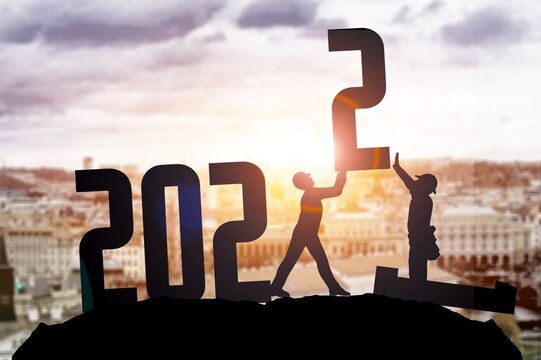 2022 New Year concept. Couple holding up .numbers
