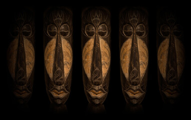 African Art Masks over black background