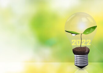 Canvas Print - Green leaves and 2022 inside the light bulb. Happy New Year 2022 concept