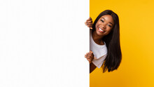 Black Woman Peeking Out Blank White Advertising Billboard At Studio