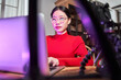 © Yakobchuk Olena - Asian woman browsing inappropriate sites at the laptop while sitting at the room