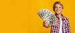 © Prostock-studio - Happy glad confident pretty european teenage boy showing a lot of dollars