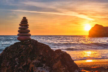 Wall Mural - Concept of balance and harmony - stone stack on the beach