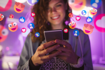 Happy young woman using her phone to interact with social media