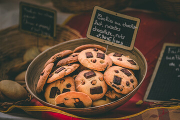 Sticker - A closeup shot of a bowl of cookies with chocolate and nuts