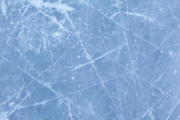 Aufkleber - Empty ice rink with skate marks after the session outdoor. skating ice rink texture covered with snow in daylight. Close up of blue ice rink floor, copy space