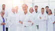 © ASDF - large group of people in white coats standing together.