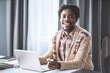 © Svyatoslav Lypynskyy - African man working from home using laptop sitting next to the window. Young entrepreneur working on his laptop at home. African american student study at home during lockdown