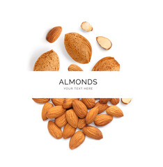 Creative layout made of almond nuts on the white background. Flat lay. Food concept.